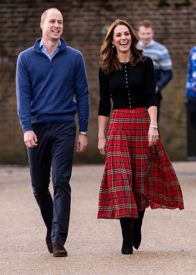 Prince William and Kate Middleton at a Christmas party for military families.
