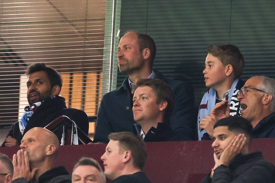 Prince William, Prince George, and others watching a soccer match.