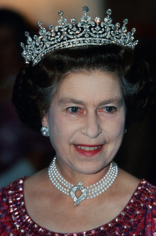 Queen Elizabeth II wearing a diamond tiara and pearl necklace.