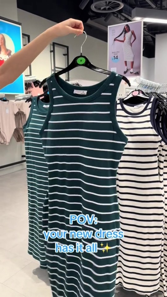 Striped dresses on hangers in a store.