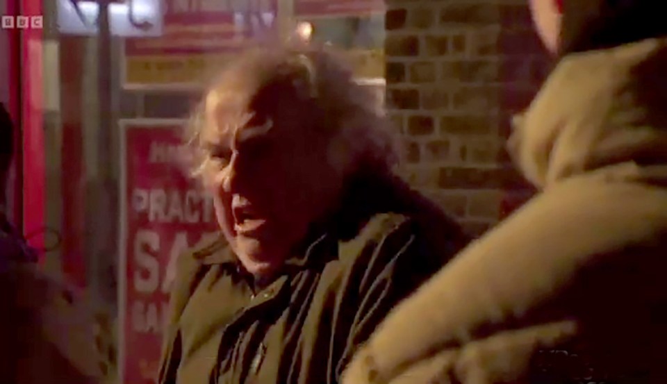 Screengrab of Nigel from Eastenders being attacked in the street.