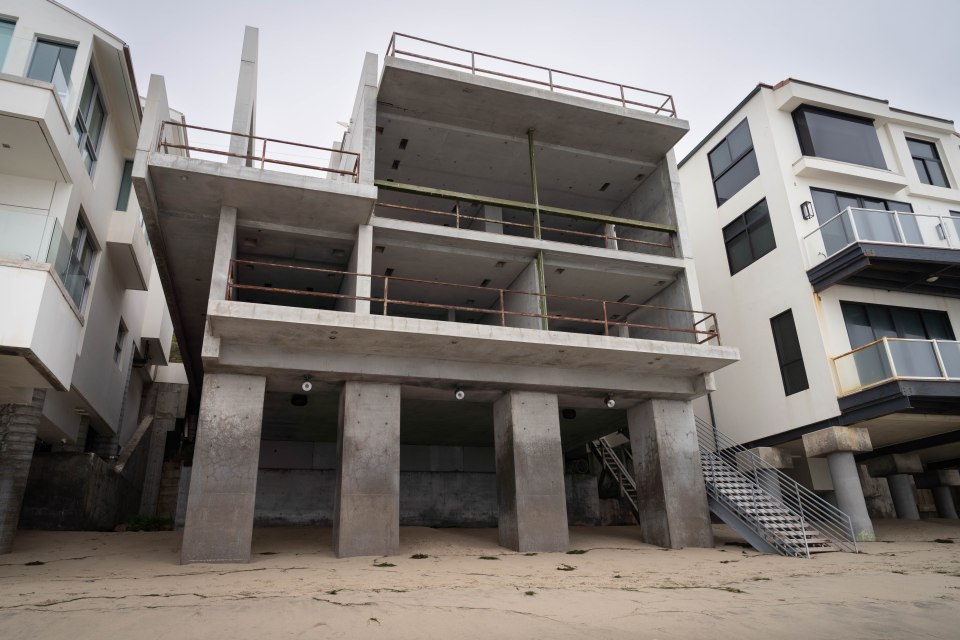 Unfinished concrete house on the beach.