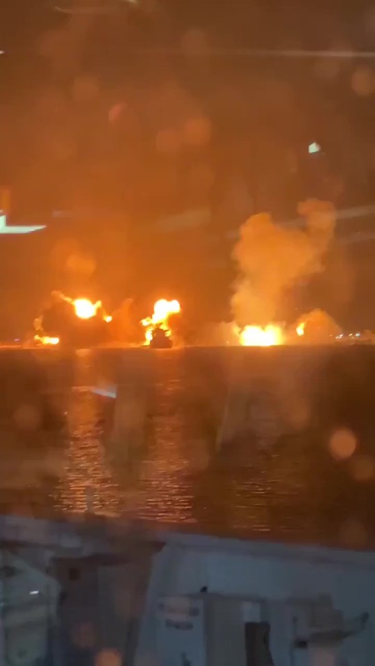 Nighttime explosions over water.