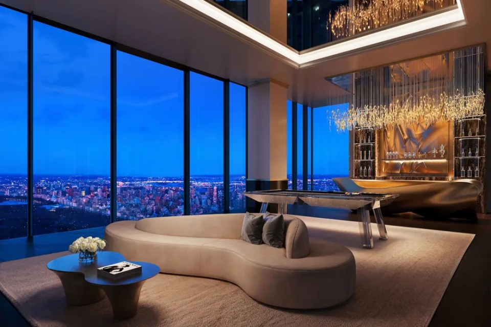 Illustration of a high-rise apartment's great room with city views at night.