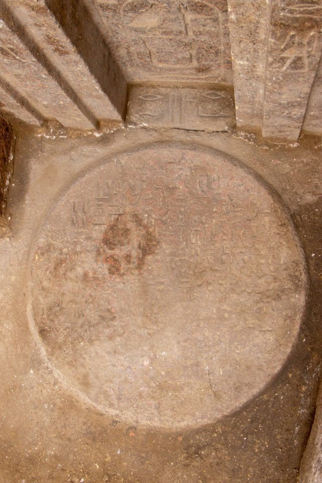 Red granite offering table with hieroglyphs from a 4,400-year-old tomb.