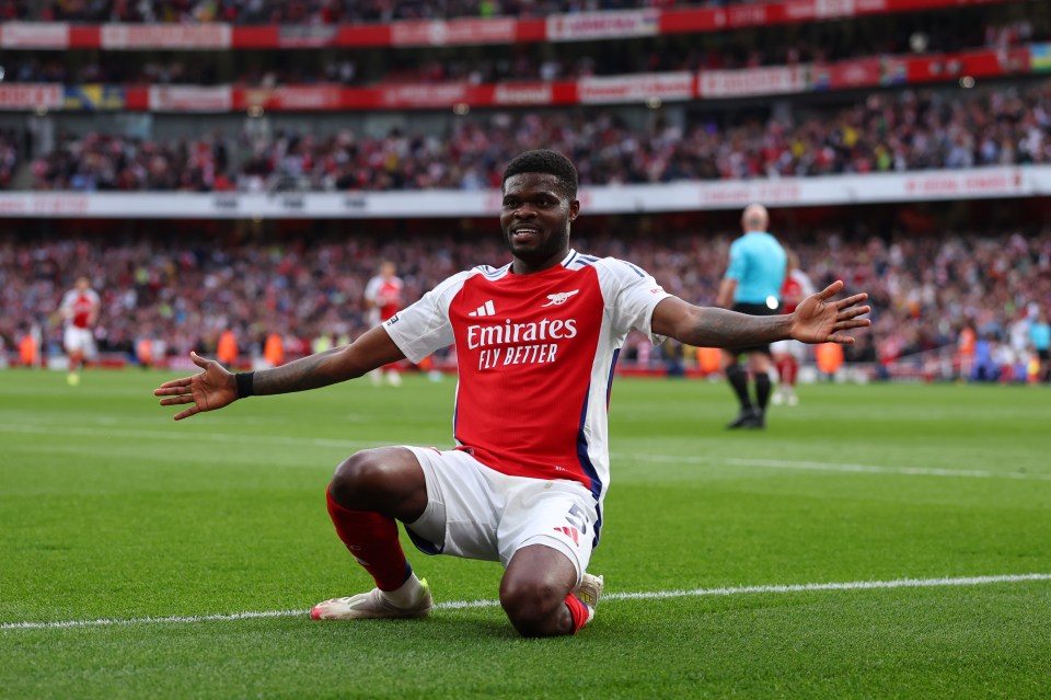 Thomas Partey of Arsenal celebrating a goal.