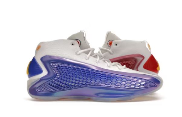 Pair of white, purple, and red basketball shoes.