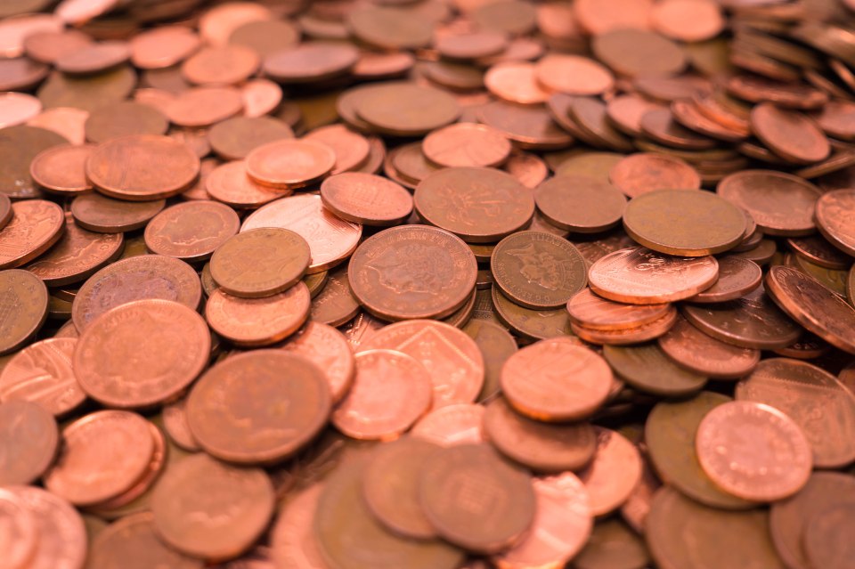 Pile of UK copper coins.