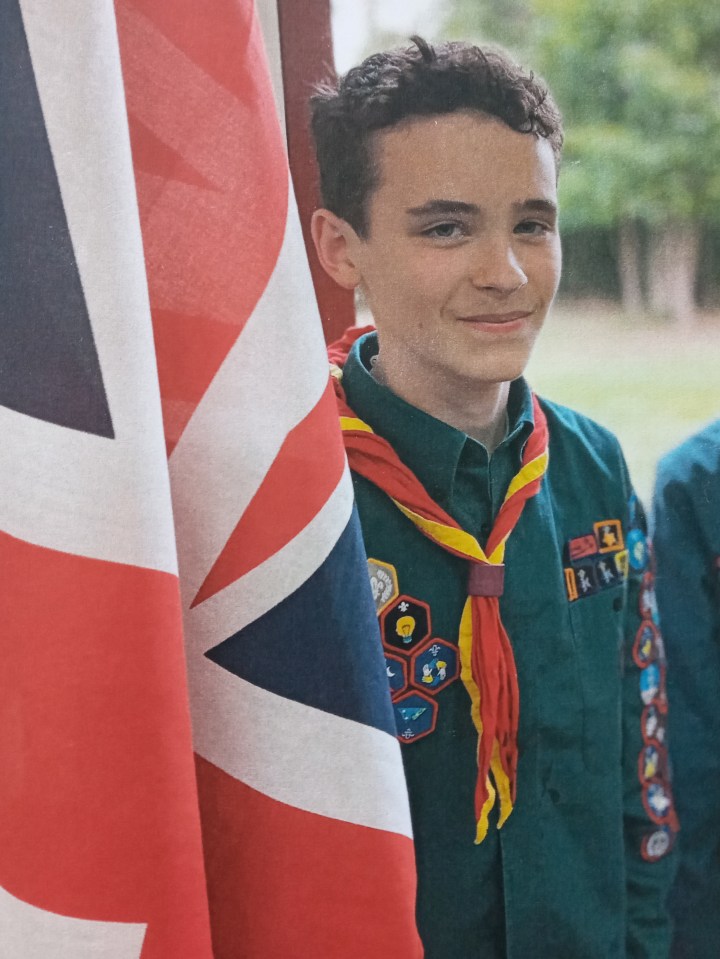 Photo of Christopher Arnett in a boy scout uniform.