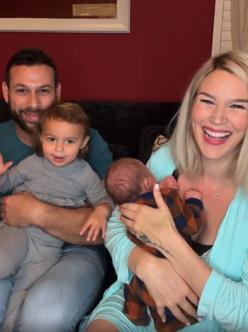 Family photo with two parents and two children.