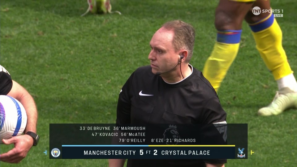 Referee watching Manchester City vs Crystal Palace game; score 5-2.