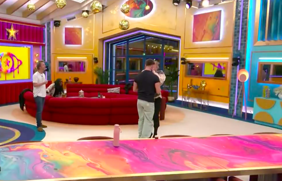 Celebrity Big Brother housemates in the living room.