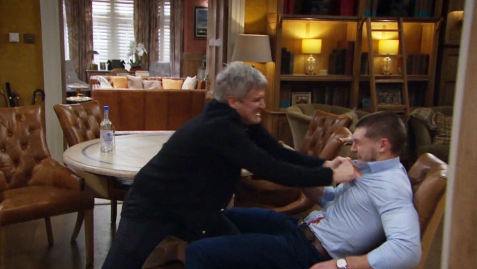 Screenshot of a scene from Emmerdale showing Caleb attacking Joe Tate.