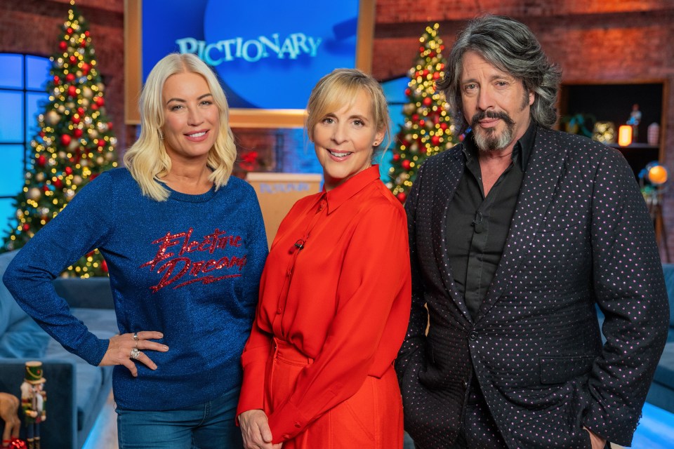 Denise Van Outen, Mel Giedroyc, and Laurence Llewelyn-Bowen on the set of Pictionary's Christmas special.