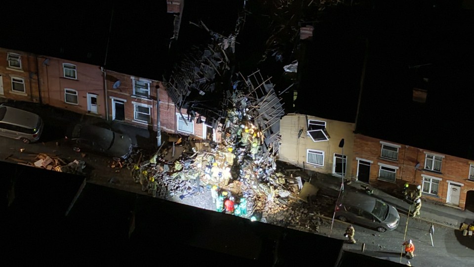 Aerial view of emergency responders at the scene of a house explosion.