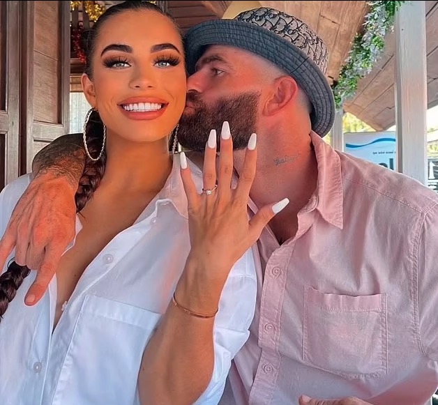 Woman showing off engagement ring.