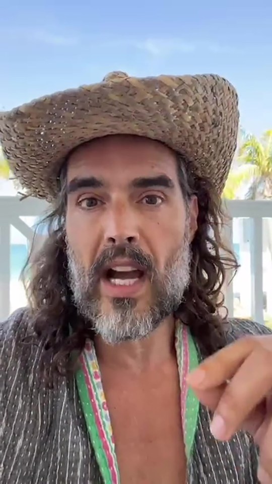 Russell Brand speaking to camera.