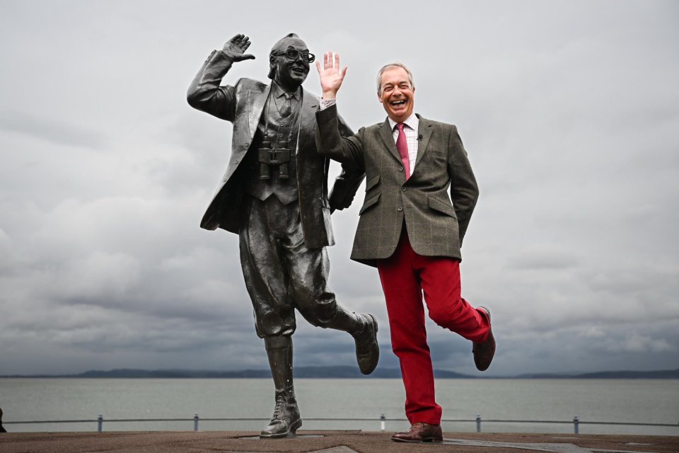 Nigel Farage with a statue of Stan Laurel.
