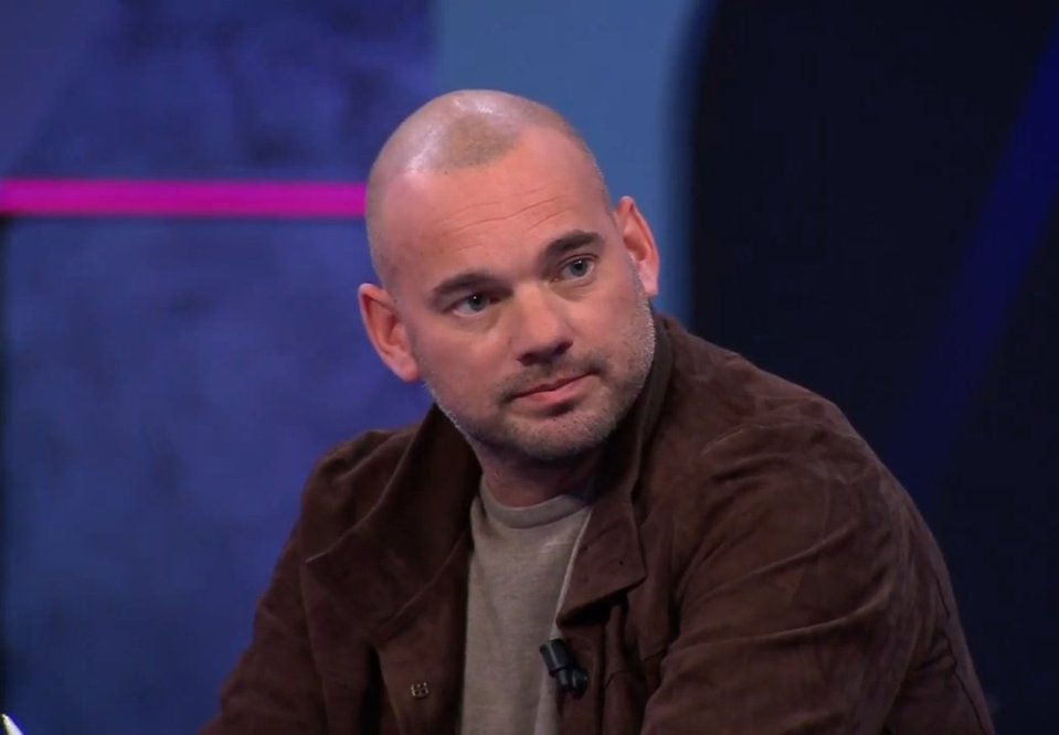 Wesley Sneijder in a brown jacket.