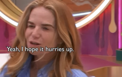 Woman saying, "Yeah, I hope it hurries up."