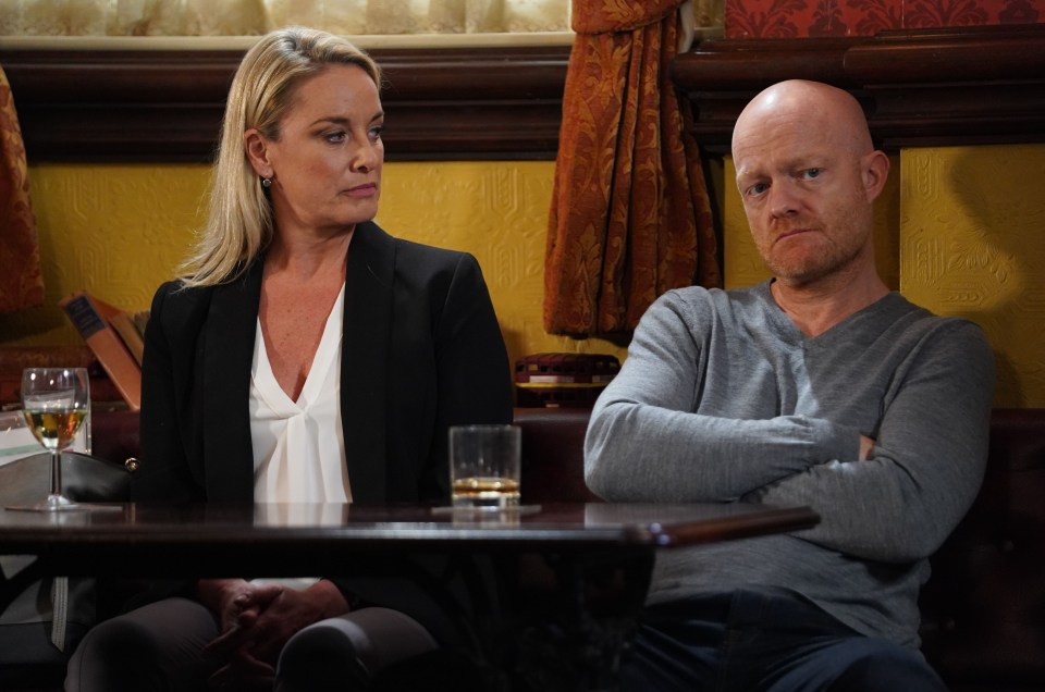 Melanie Owen and Max Branning seated at a table in a pub.