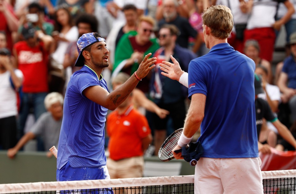 Nick Kyrgios and Kevin Anderson shaking hands after a tennis match.