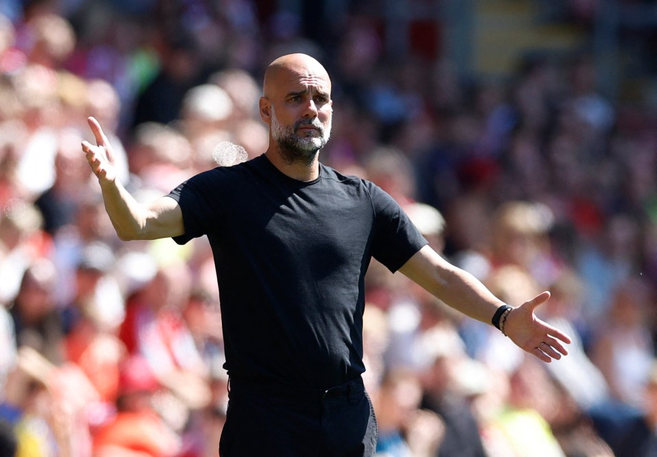 Pep Guardiola reacting during a soccer match.