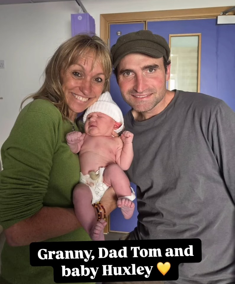 Granny, Dad Tom, and baby Huxley.