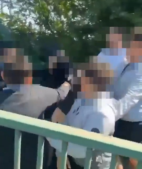 Police making arrests following a school assault.