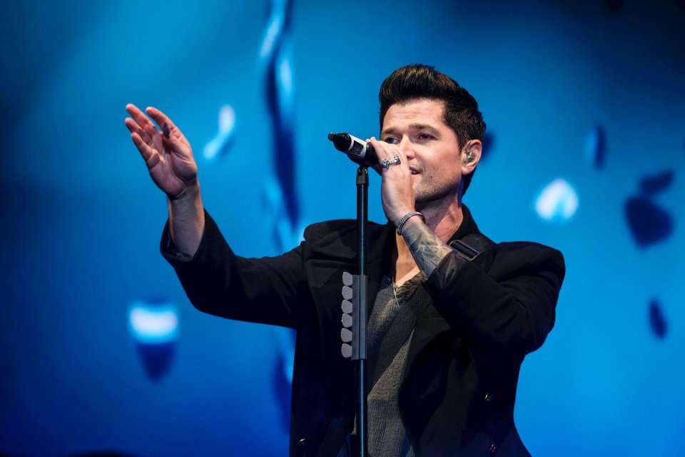 Danny O'Donoghue of The Script performing live on stage.