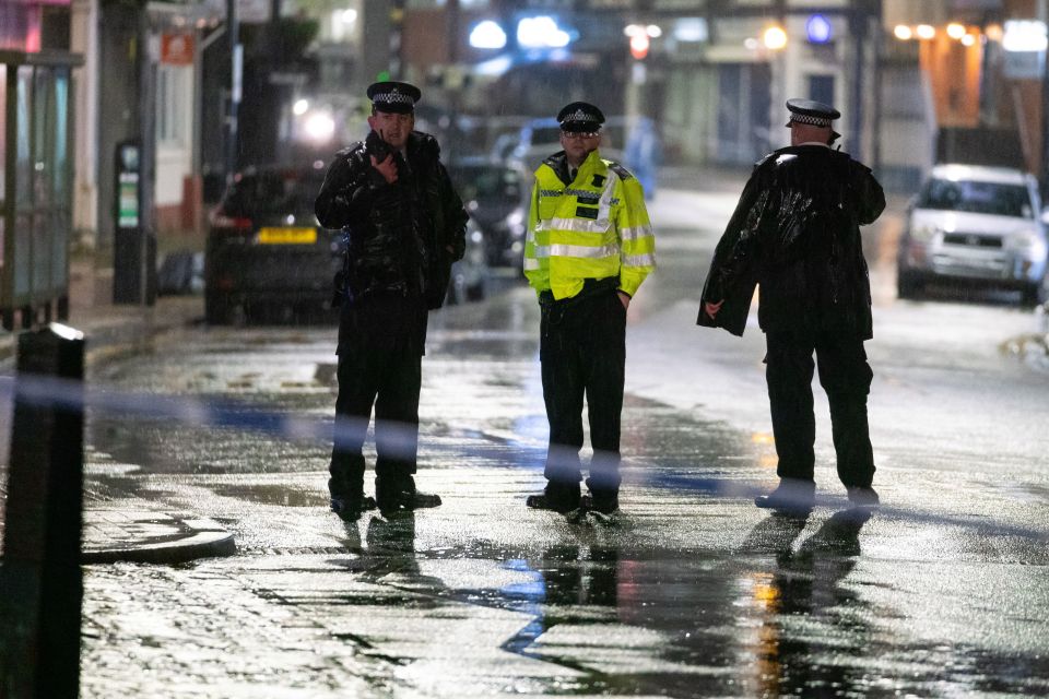Police officers at a crime scene.