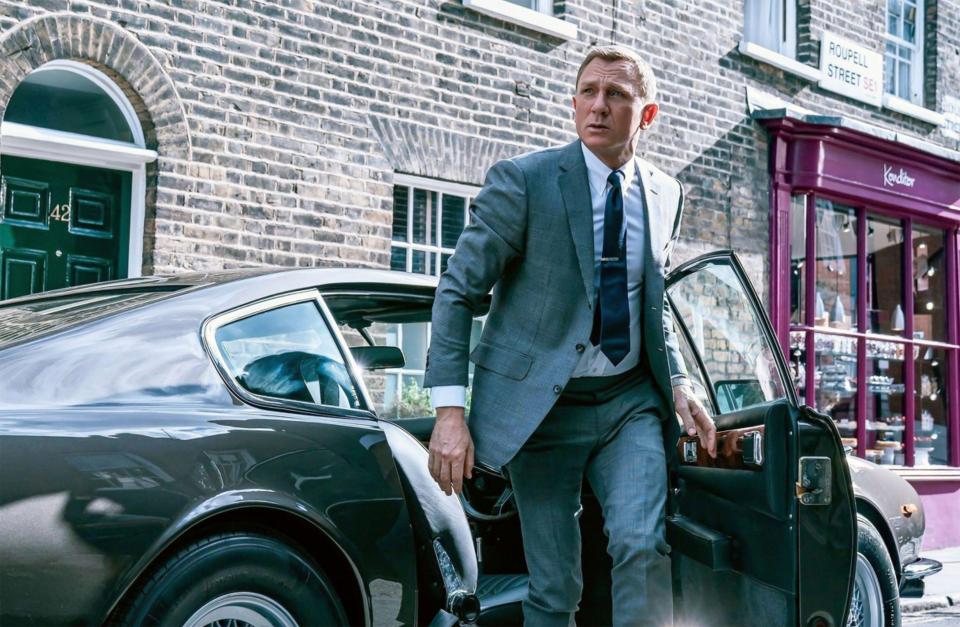 Daniel Craig as James Bond exiting a car.