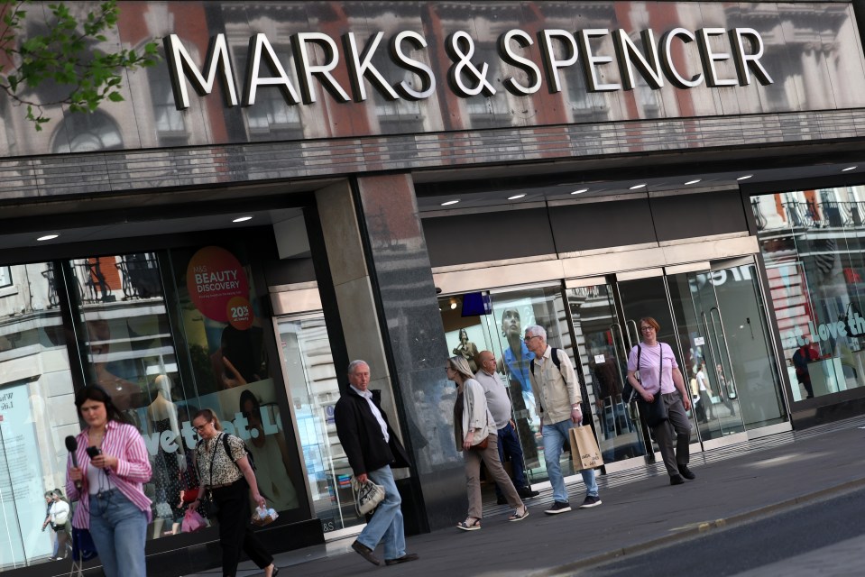 Pedestrians outside a Marks & Spencer store in London.