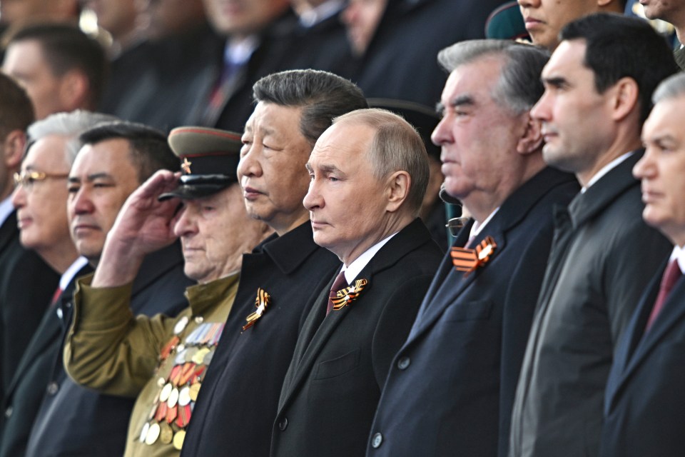 World leaders at a military parade.