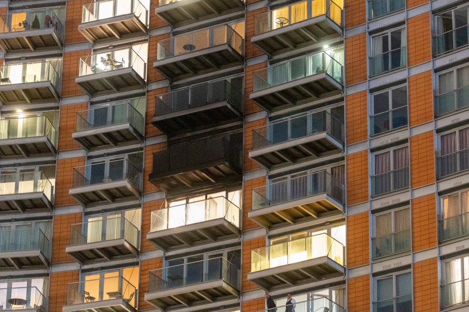 Apartment building fire; damage visible on one balcony.