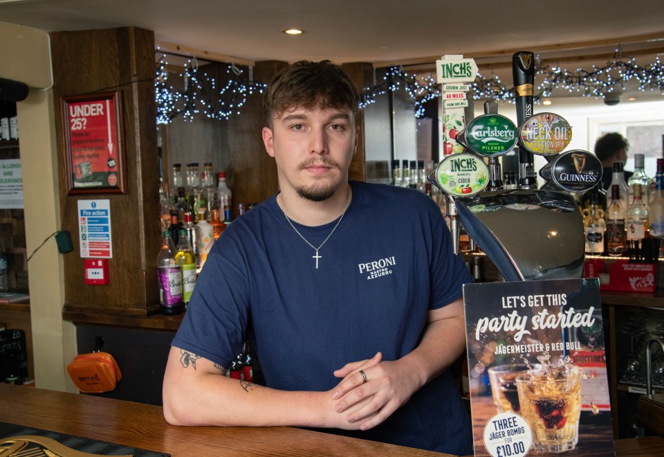 Bartender at a pub counter.