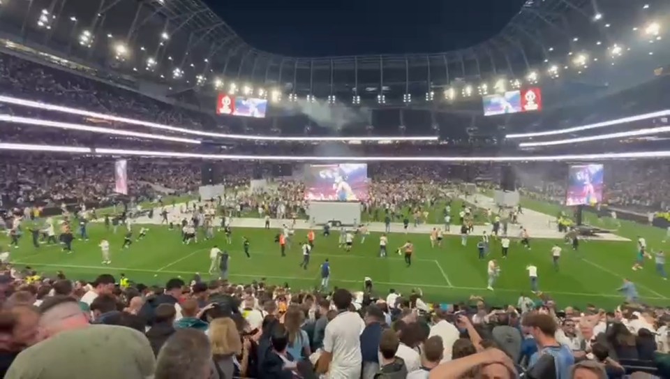 Tottenham Hotspur fans celebrating a Europa League victory at Tottenham Hotspur Stadium.