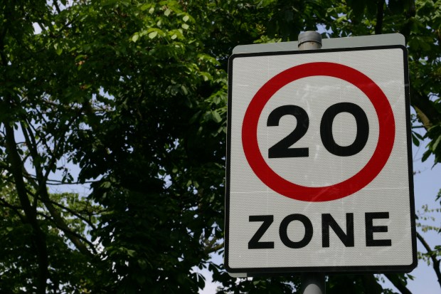 20 mph speed limit zone sign.