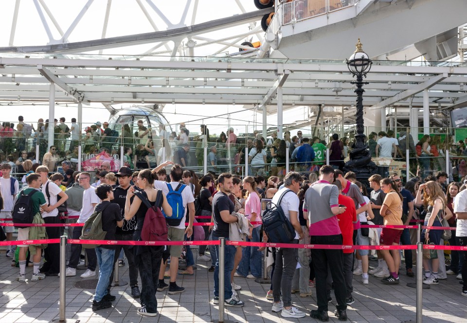 Long queue of people waiting to ride the London Eye.