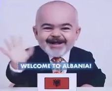 AI-generated image of baby-faced Keir Starmer, Macron, and Leyen waving and saying "Welcome to Albania!" at the European Political Community summit.