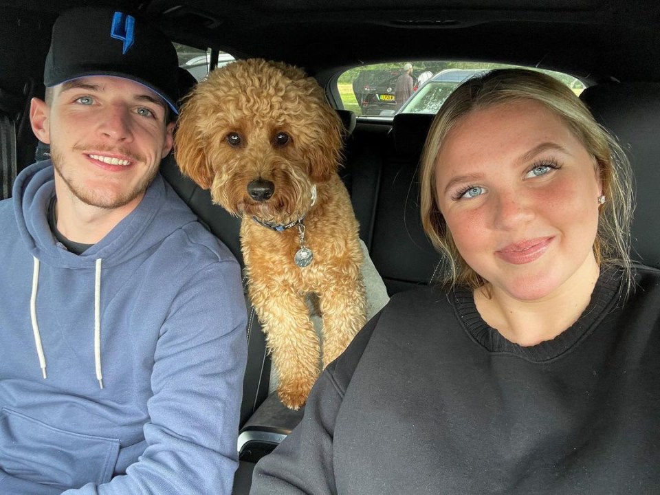Declan Rice, his girlfriend, and their dog in a car.