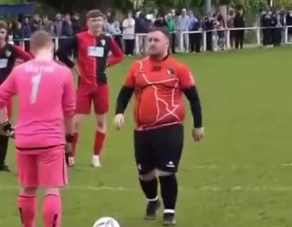 Luke Littler taking a penalty kick for Winton Yanited.