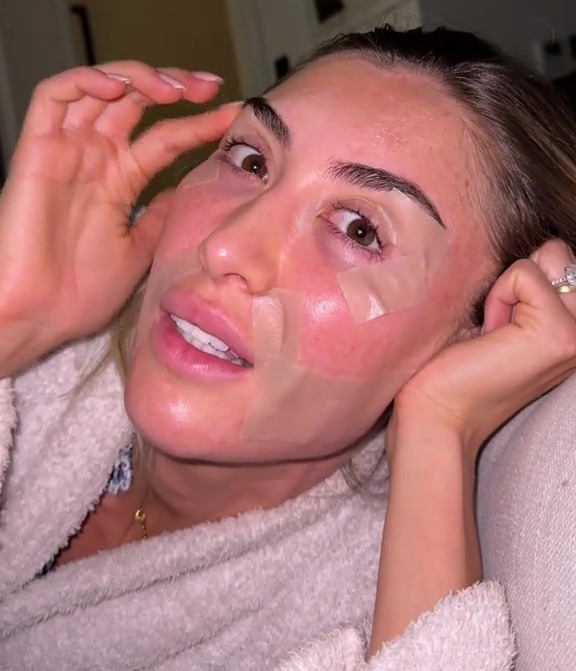 Woman with eye patches on her face.
