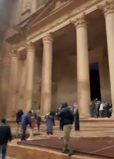 Tourists being evacuated from Petra's Treasury after flash floods.
