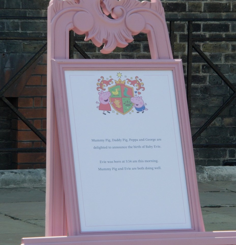 Pink easel announcing the birth of Baby Evie to the Peppa Pig family.