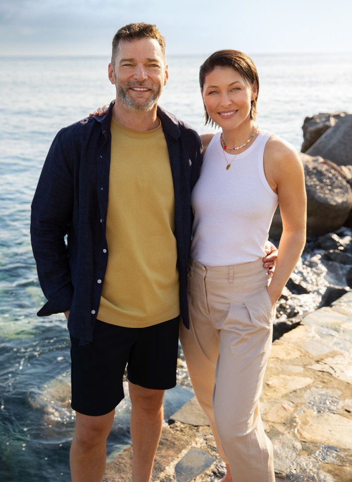 Emma Willis and a man by the ocean.