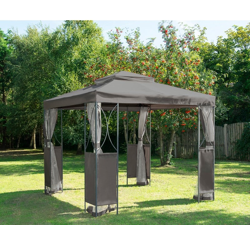 Gazebo with curtains in a garden.