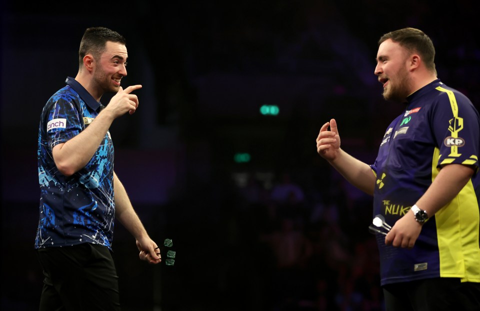 Luke Humphries (left) speaks with Luke Littler during the final on night sixteen of the BetMGM Premier League at the Utilita Arena, Sheffield. Picture date: Thursday May 22, 2025. PA Photo. See PA story DARTS Sheffield. Photo credit should read: Nigel French/PA Wire. RESTRICTIONS: Use subject to restrictions. Editorial use only, no commercial use without prior consent from rights holder.