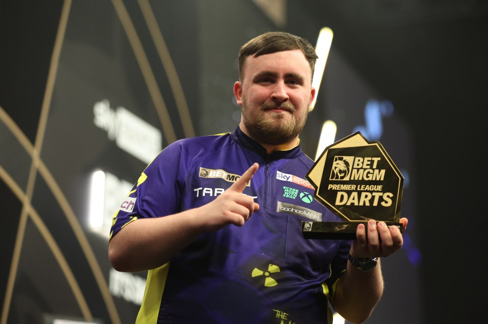 Winner Luke Littler poses with the trophy after victory in the final on night sixteen of the BetMGM Premier League at the Utilita Arena, Sheffield. Picture date: Thursday May 22, 2025. PA Photo. See PA story DARTS Sheffield. Photo credit should read: Nigel French/PA Wire. RESTRICTIONS: Use subject to restrictions. Editorial use only, no commercial use without prior consent from rights holder.