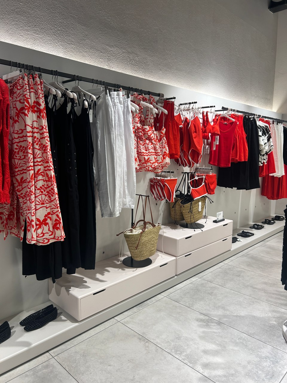 Clothing and accessories displayed in a retail store.